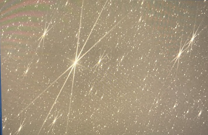 Computer screen showing a bright star with crossed diffraction spikes from a Bahtinov focusing mask