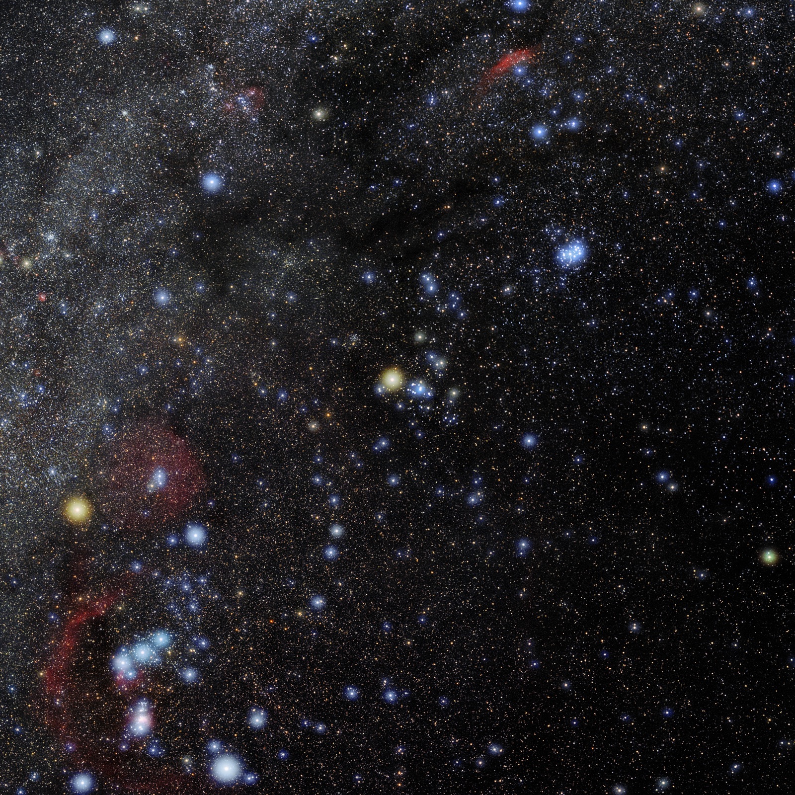 Star field of Taurus with the compact blue Pleiades cluster and a V of stars around an orange star.