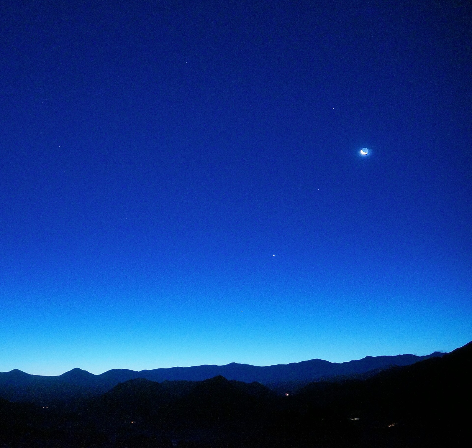 Crescent Moon with Venus, Saturn and Mercury in a dawn twilight sky